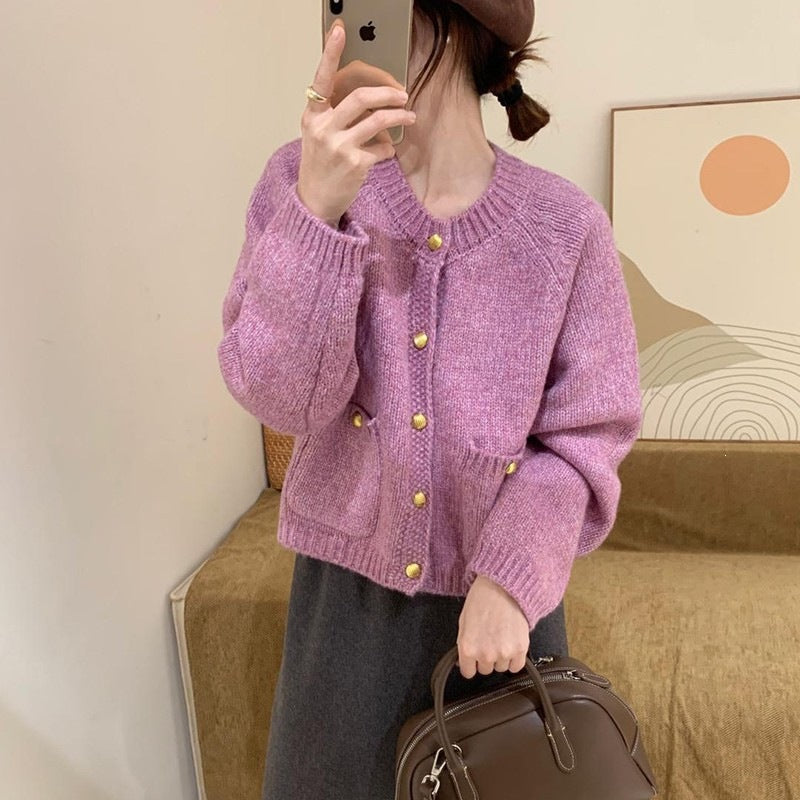 Cardigan con tasche e bottoni dorati