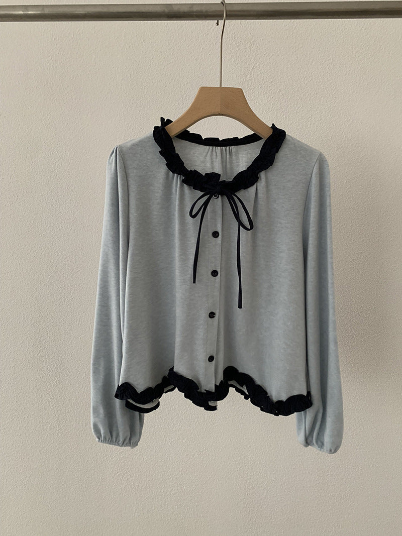 Blusa con fiocco e bordi a contrasto