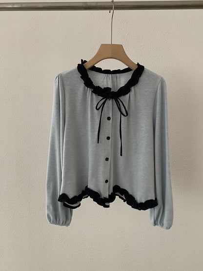 Blusa con fiocco e bordi a contrasto