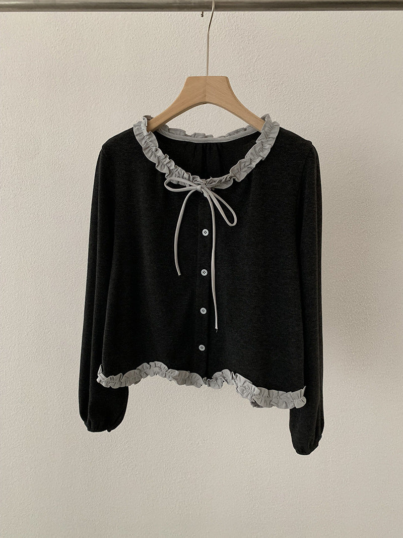 Blusa con fiocco e bordi a contrasto
