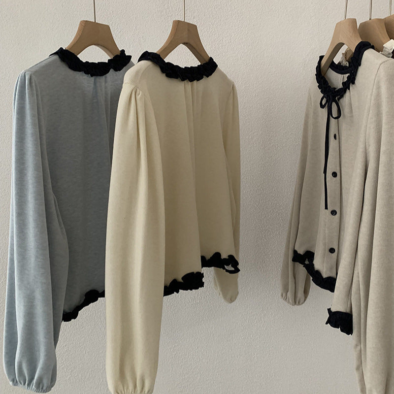 Blusa con fiocco e bordi a contrasto