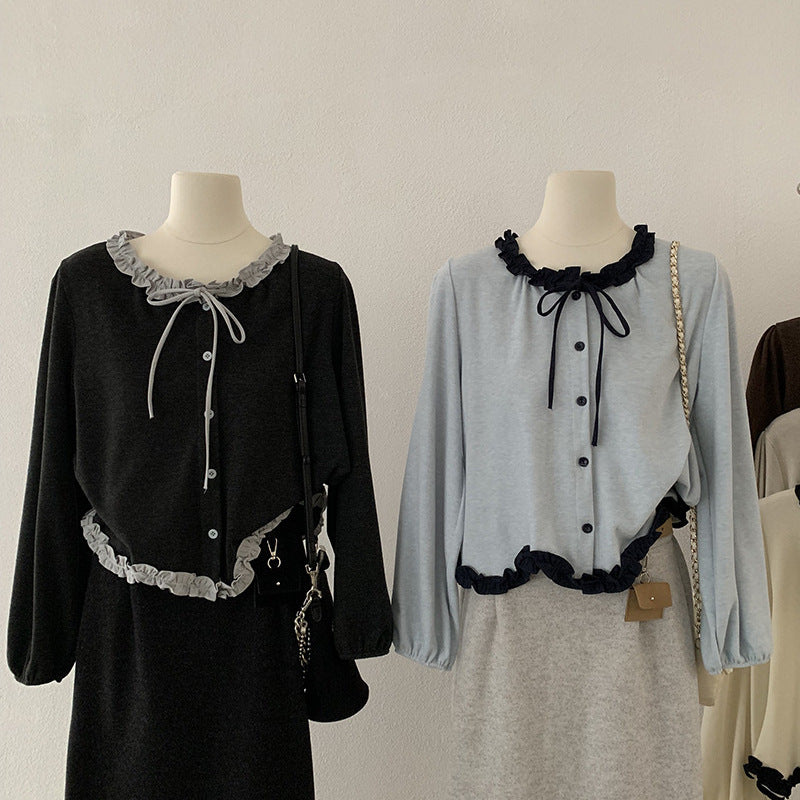 Blusa con fiocco e bordi a contrasto