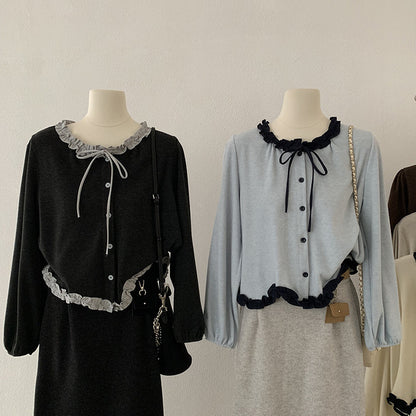 Blusa con fiocco e bordi a contrasto