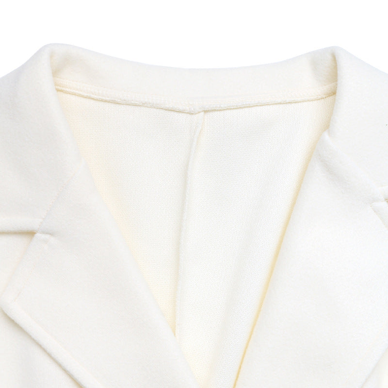 Cappotto beige doppiopetto con revers