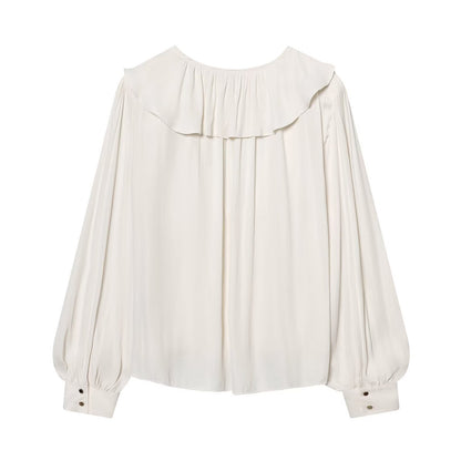 Blusa satinata con volant e maniche lunghe