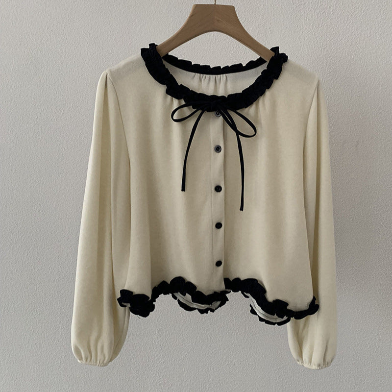 Blusa con fiocco e bordi a contrasto