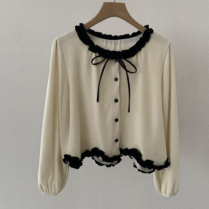 Blusa con fiocco e bordi a contrasto