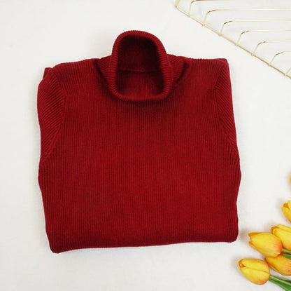 Abito aderente in maglia a collo alto