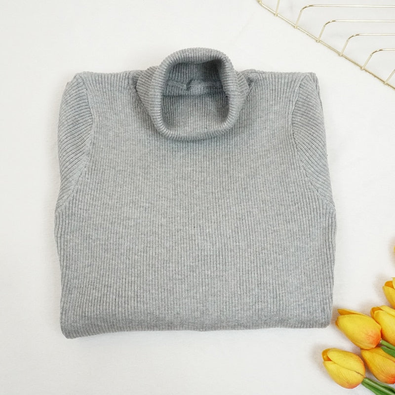 Abito aderente in maglia a collo alto