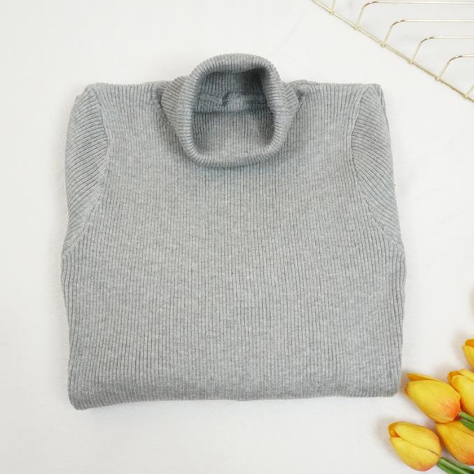 Abito aderente in maglia a collo alto