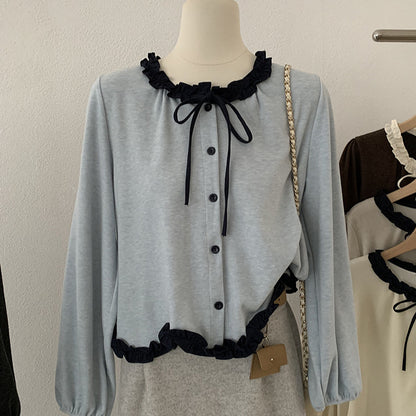 Blusa con fiocco e bordi a contrasto