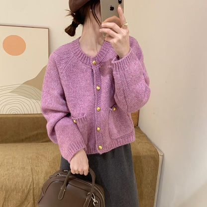 Cardigan con tasche e bottoni dorati
